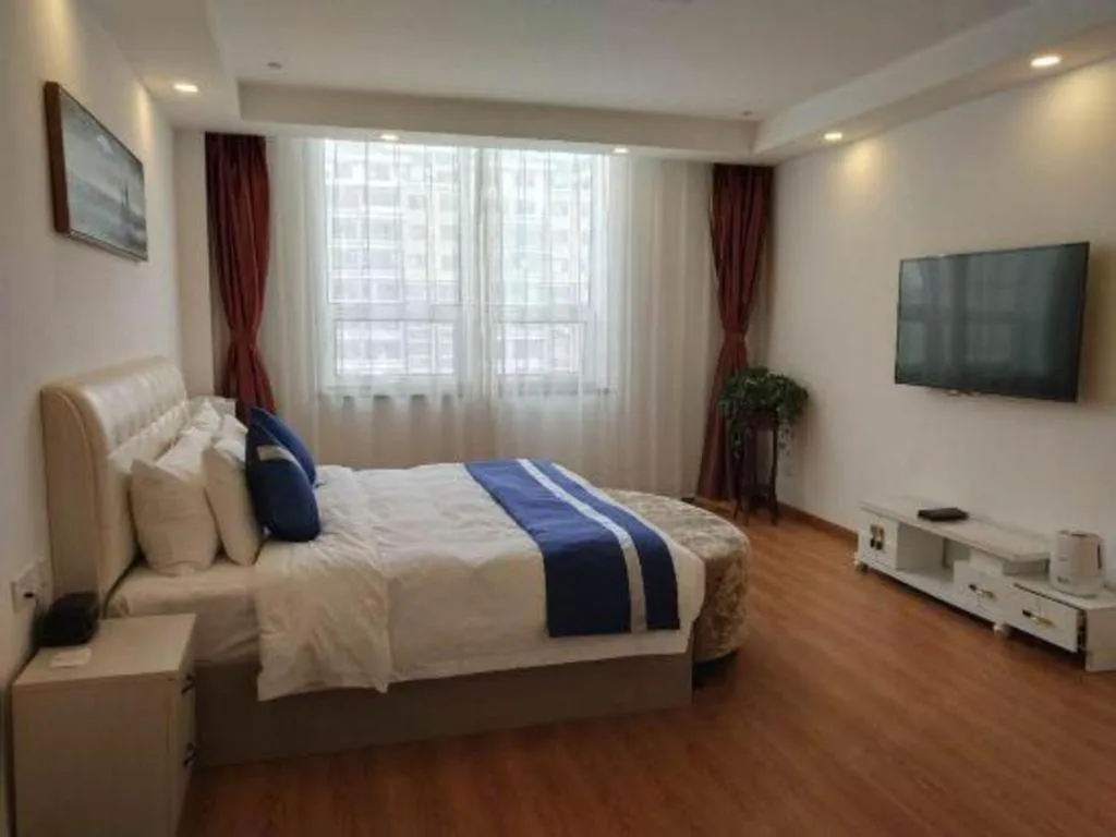 Bed in New Century Grand Changchun Hotel