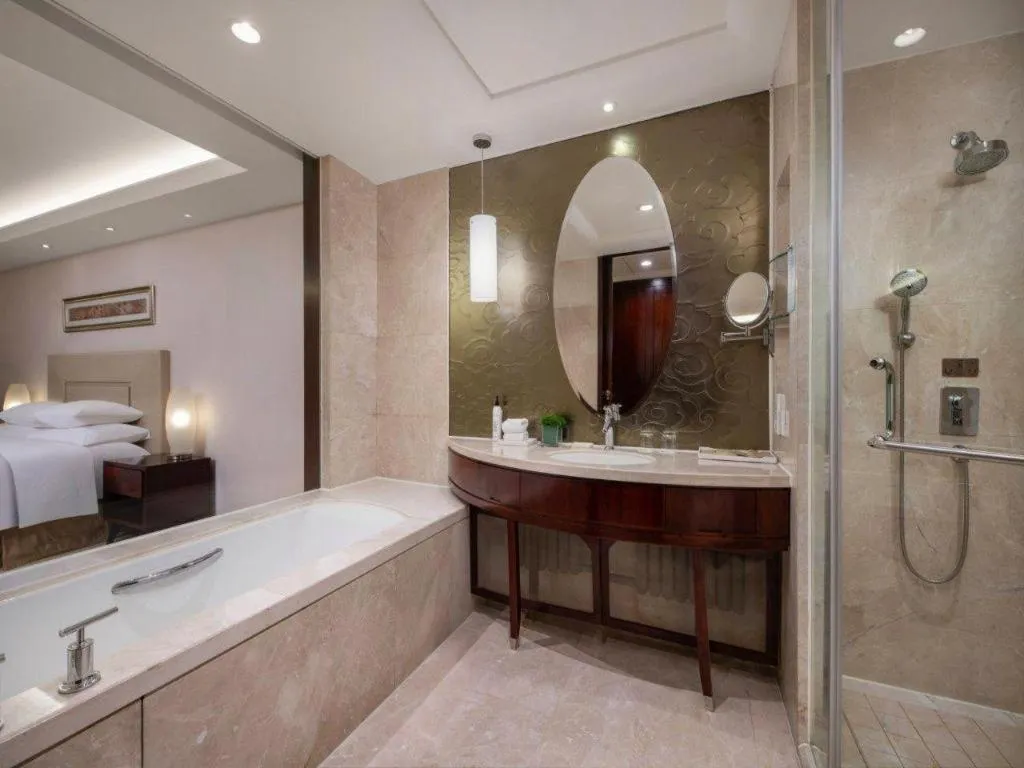 Bed in New Century Grand Changchun Hotel