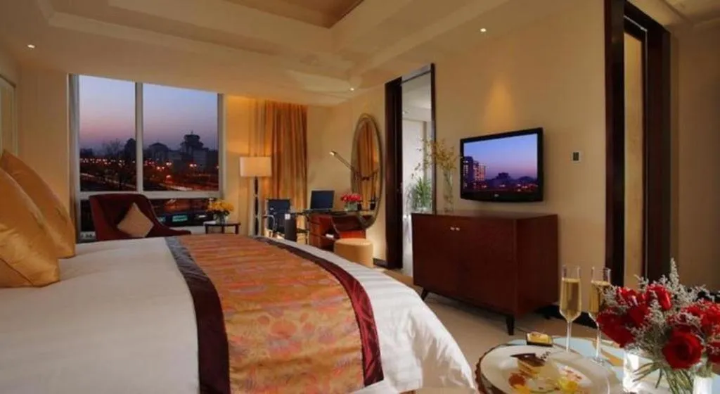 Bed in New Century Grand Changchun Hotel