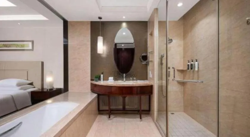 Bed in New Century Grand Changchun Hotel