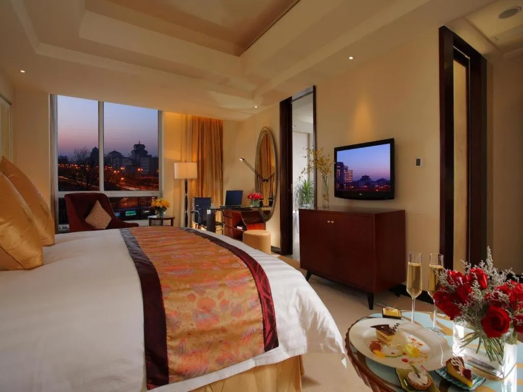 Bed in New Century Grand Changchun Hotel