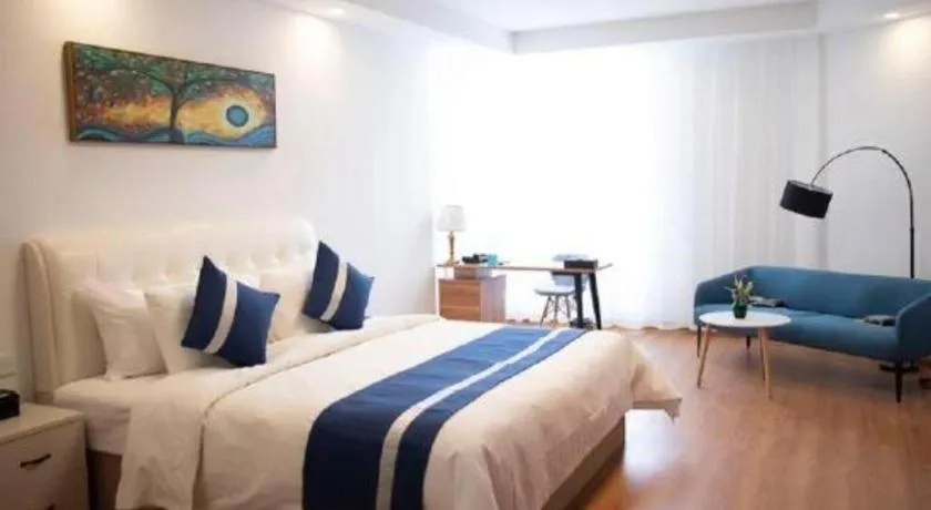 Bed in New Century Grand Changchun Hotel