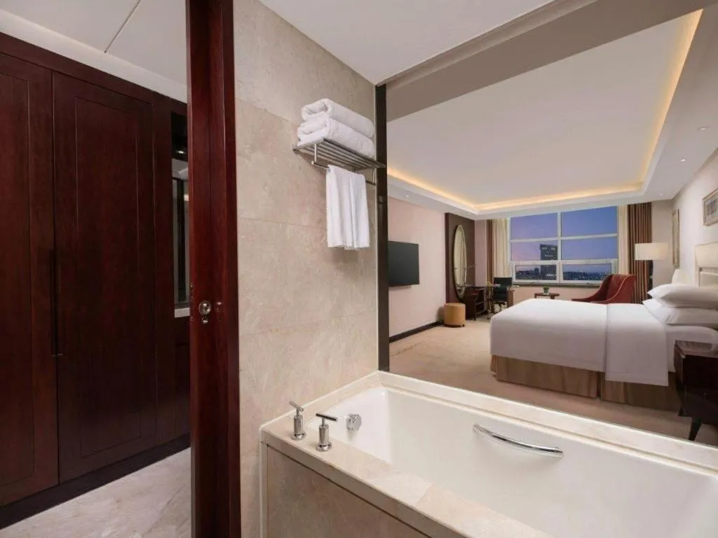 Bed in New Century Grand Changchun Hotel