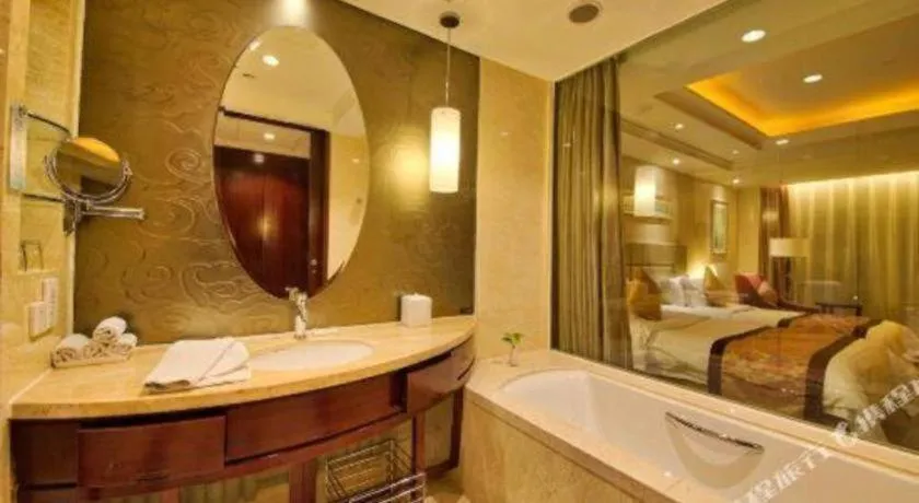 Bed in New Century Grand Changchun Hotel