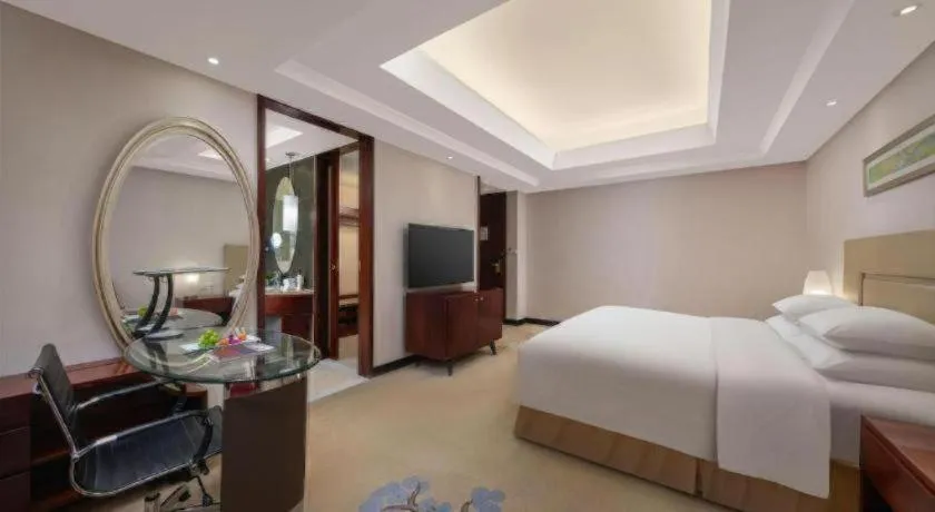 Bed in New Century Grand Changchun Hotel