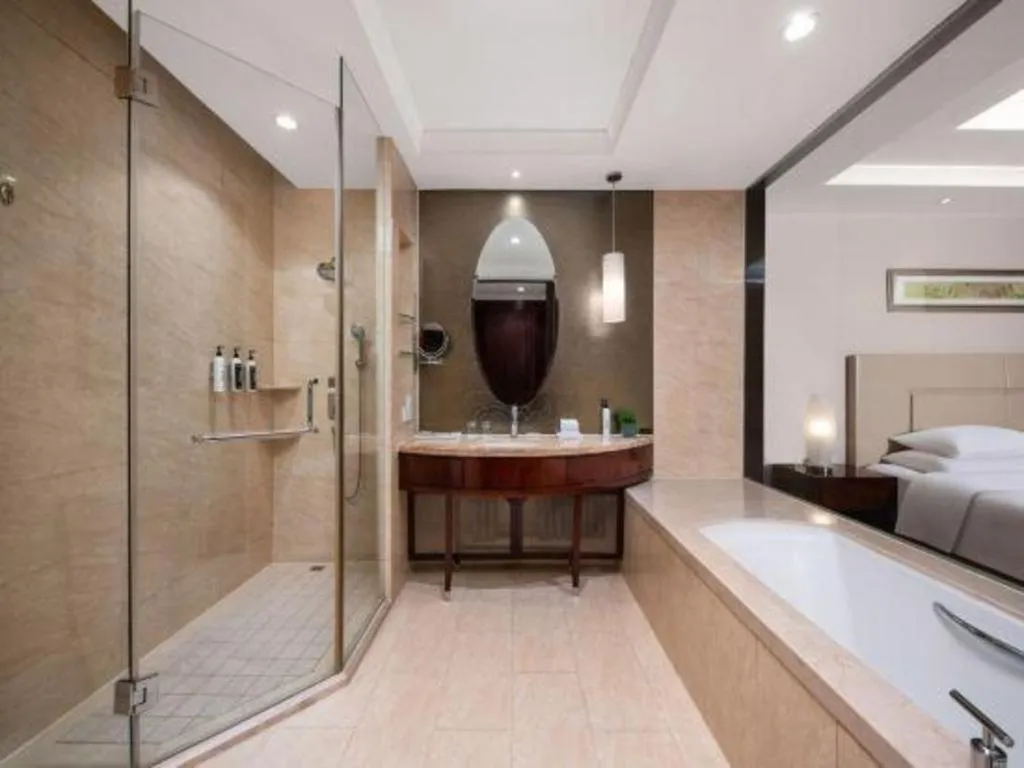 Bed in New Century Grand Changchun Hotel