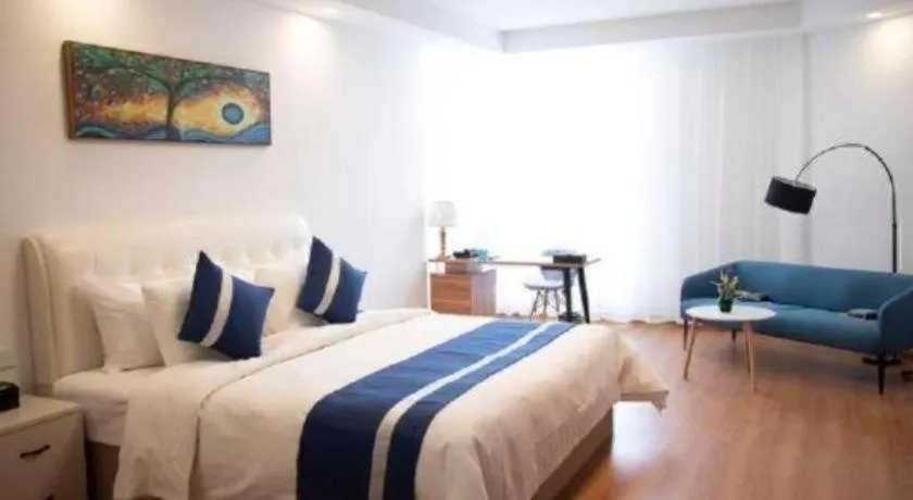 Bed in New Century Grand Changchun Hotel