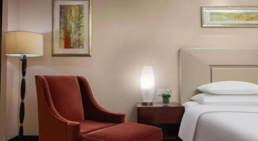 Bed in New Century Grand Changchun Hotel