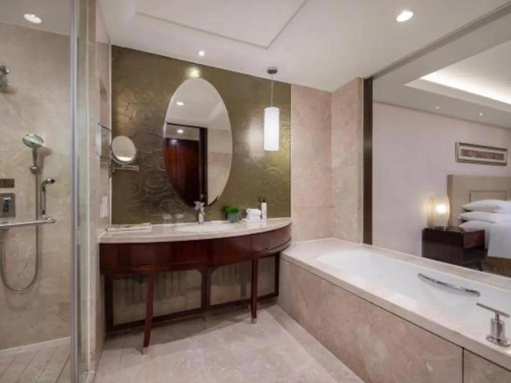 Bed in New Century Grand Changchun Hotel