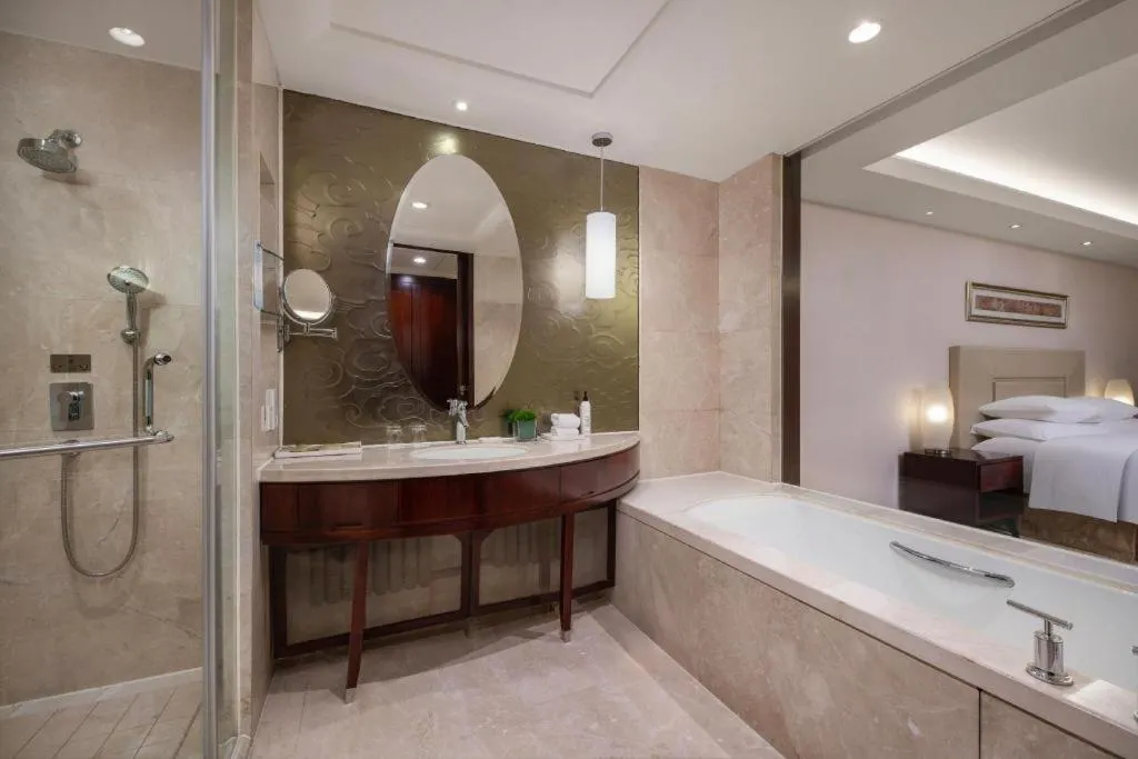 Bed in New Century Grand Changchun Hotel