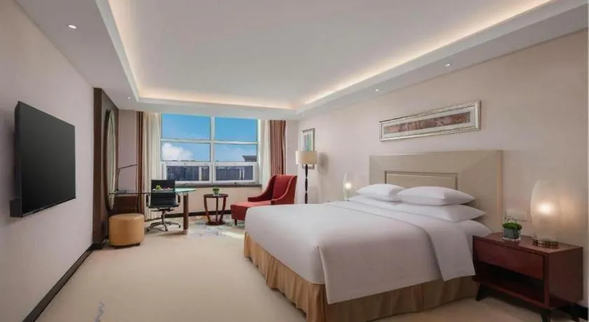 Bed in New Century Grand Changchun Hotel