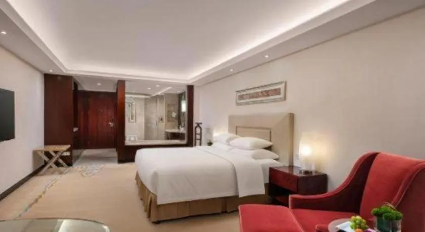 Bed in New Century Grand Changchun Hotel