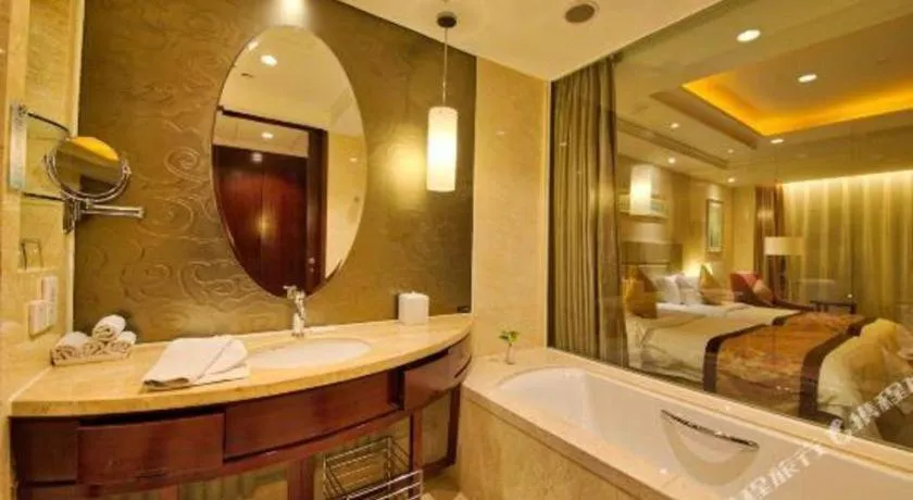 Bed in New Century Grand Changchun Hotel