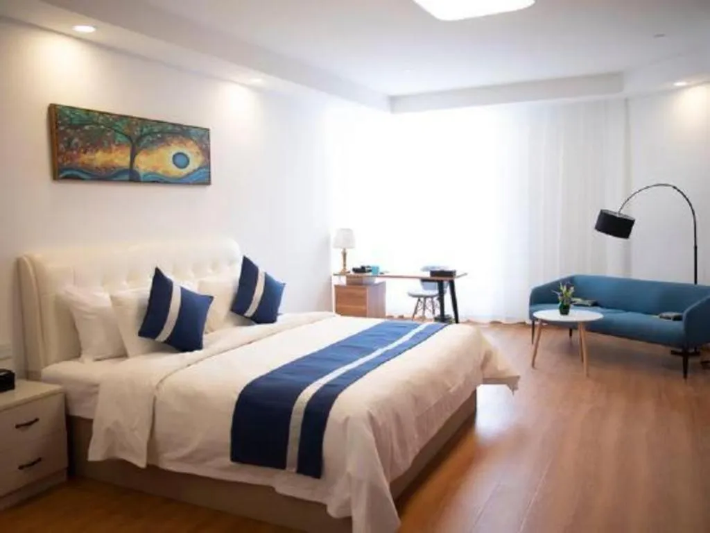 Bed in New Century Grand Changchun Hotel