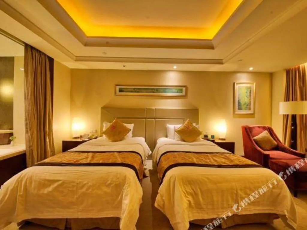 Bed in New Century Grand Changchun Hotel