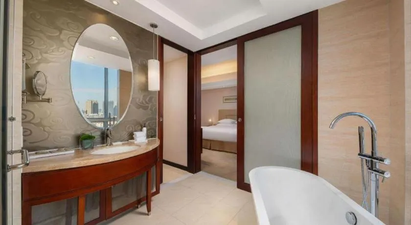 Bed in New Century Grand Changchun Hotel