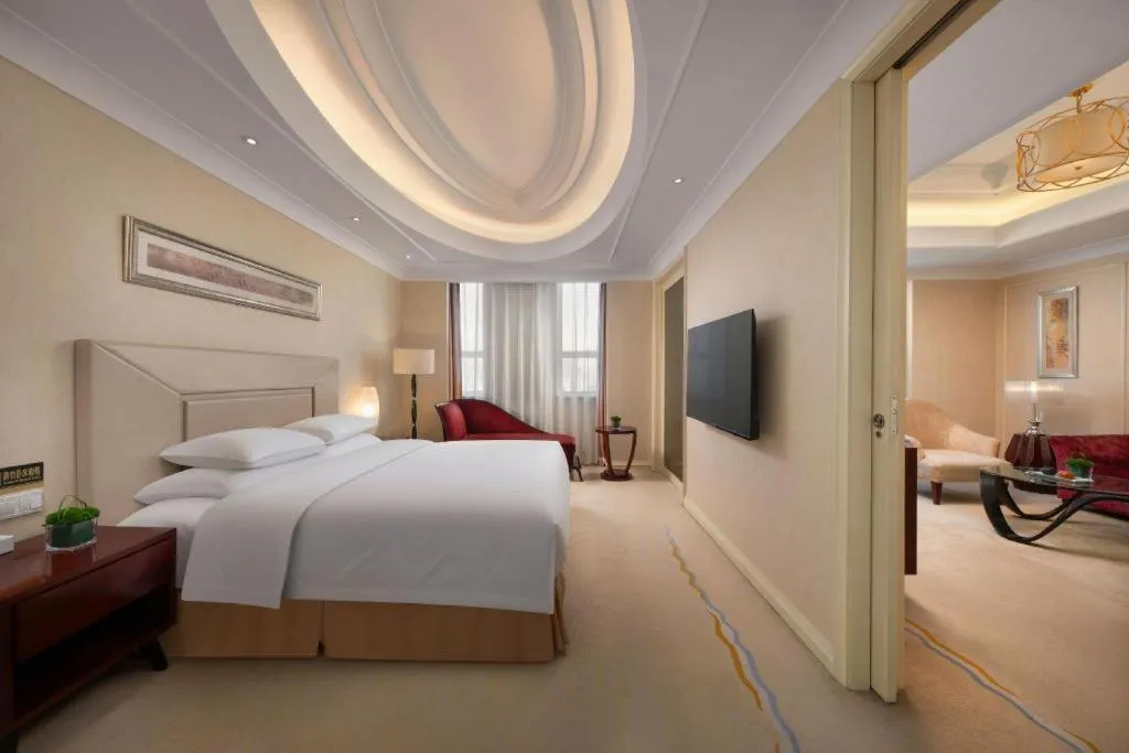 Bed in New Century Grand Changchun Hotel