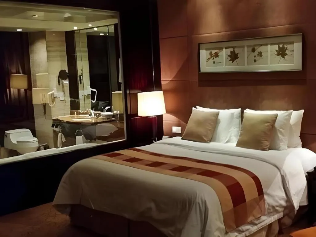 Bed in New Century Grand Hotel Xuzhou