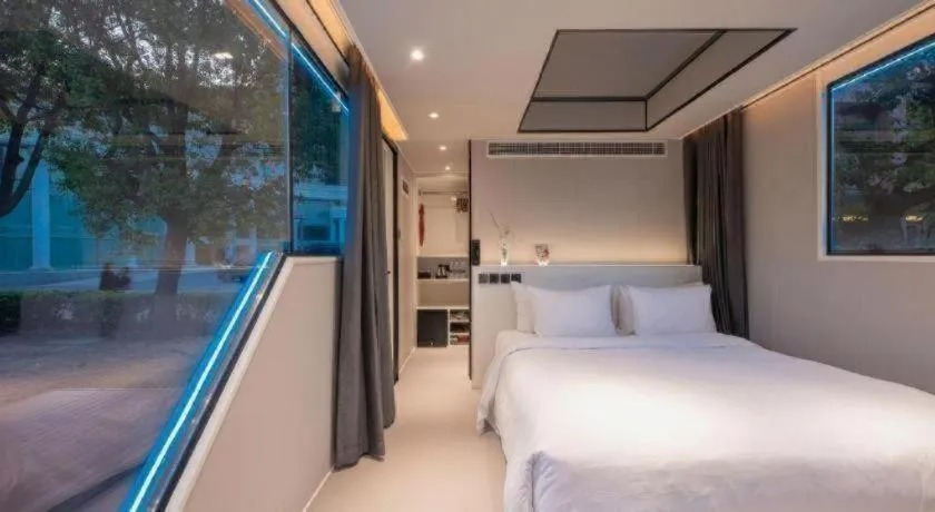 Bed in New Century Grand Hotel Xuzhou