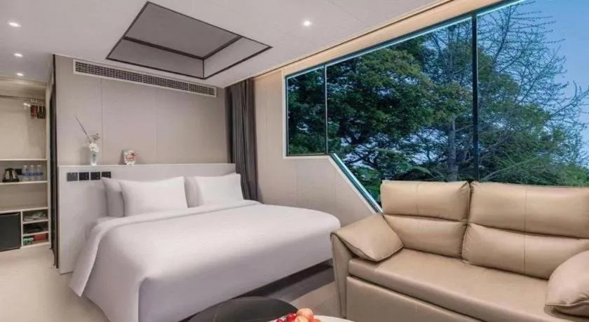 Bed in New Century Grand Hotel Xuzhou