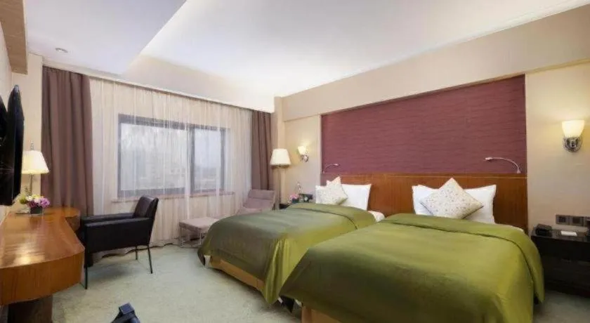 Bed in Xian Grand Noble Hotel