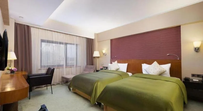 Bed in Xian Grand Noble Hotel