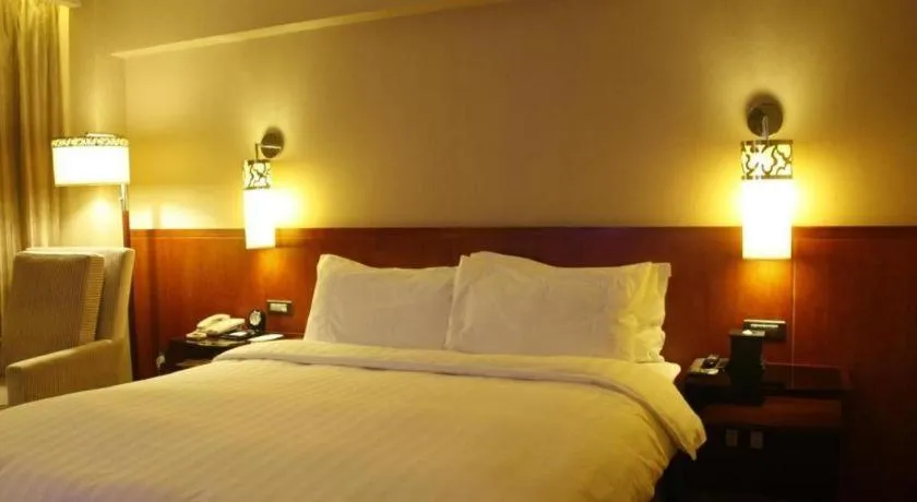 Bed in Xian Grand Noble Hotel