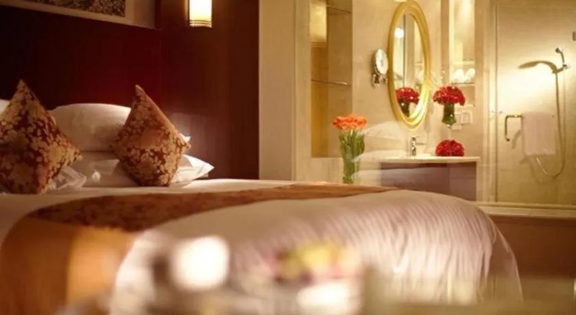 Bed in New Century Hotel Zaozhuang Fengming