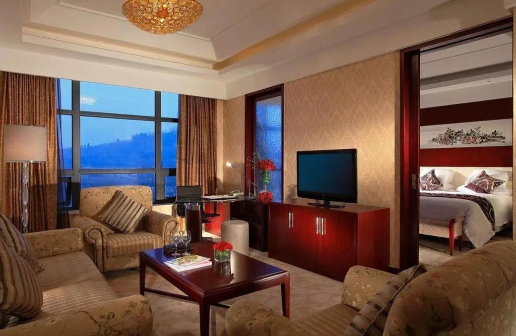 Bed in New Century Hotel Zaozhuang Fengming