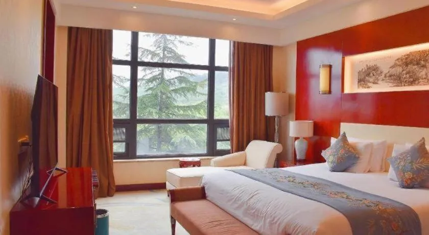 Bed in New Century Hotel Zaozhuang Fengming