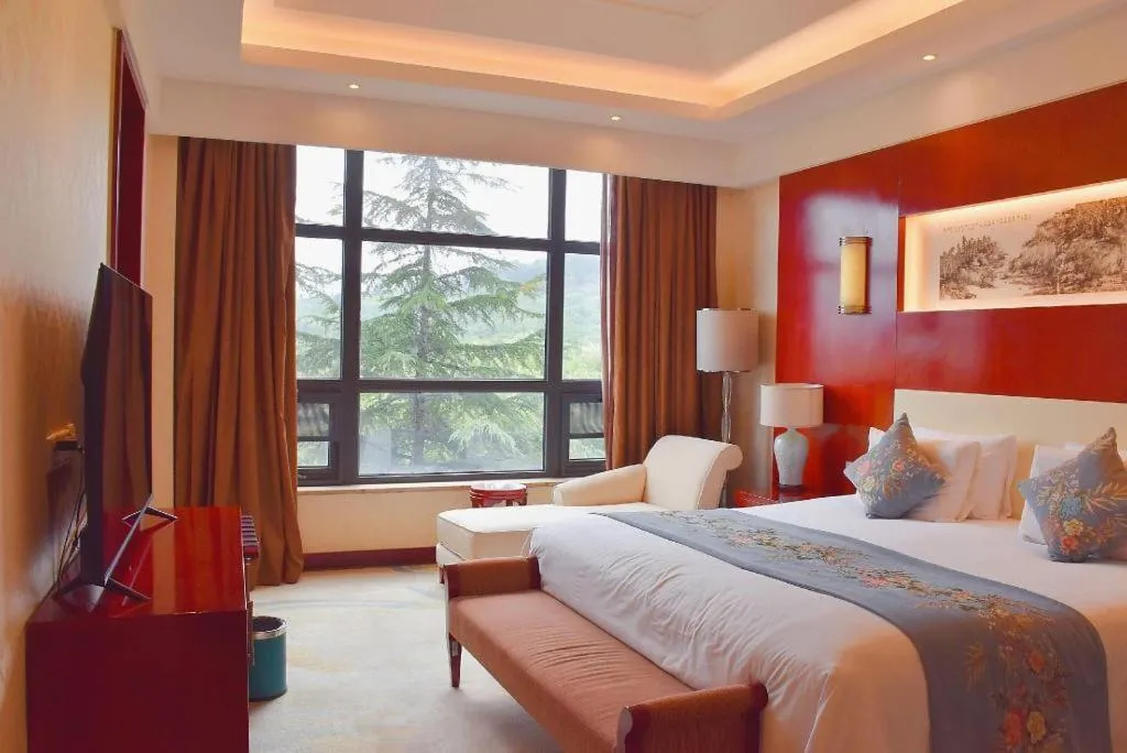 Bed in New Century Hotel Zaozhuang Fengming