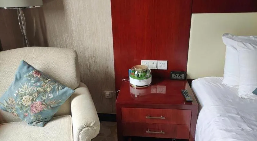 Bed in New Century Hotel Zaozhuang Fengming