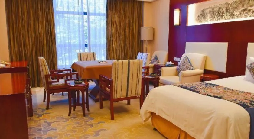 Bed in New Century Hotel Zaozhuang Fengming
