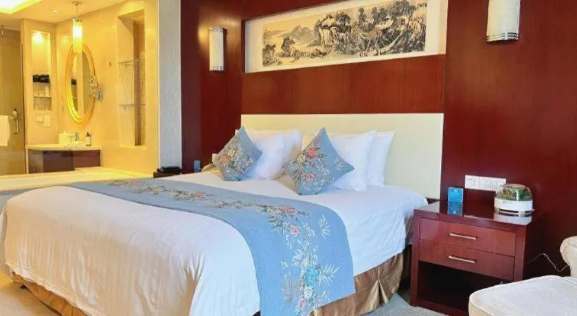 Bed in New Century Hotel Zaozhuang Fengming