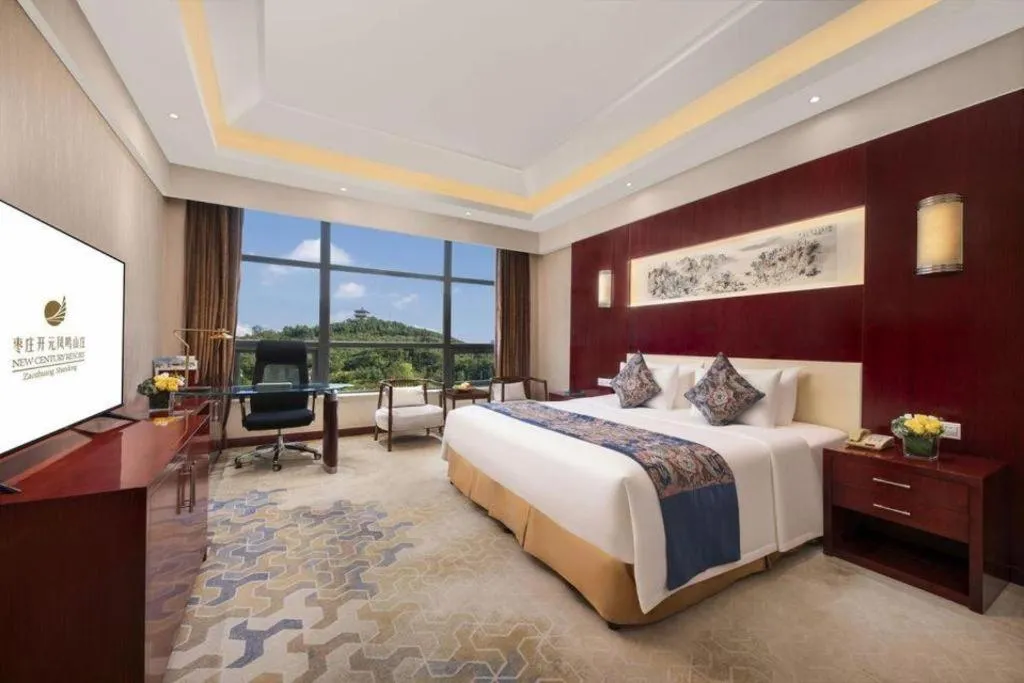 Bed in New Century Hotel Zaozhuang Fengming