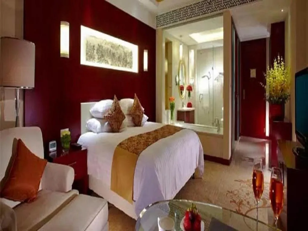 Bed in New Century Hotel Zaozhuang Fengming