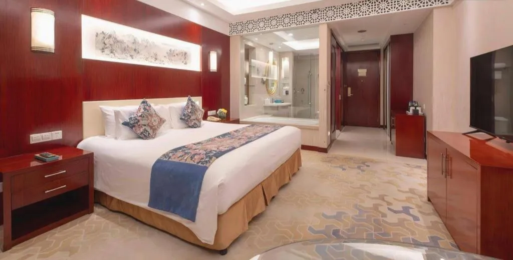Bed in New Century Hotel Zaozhuang Fengming