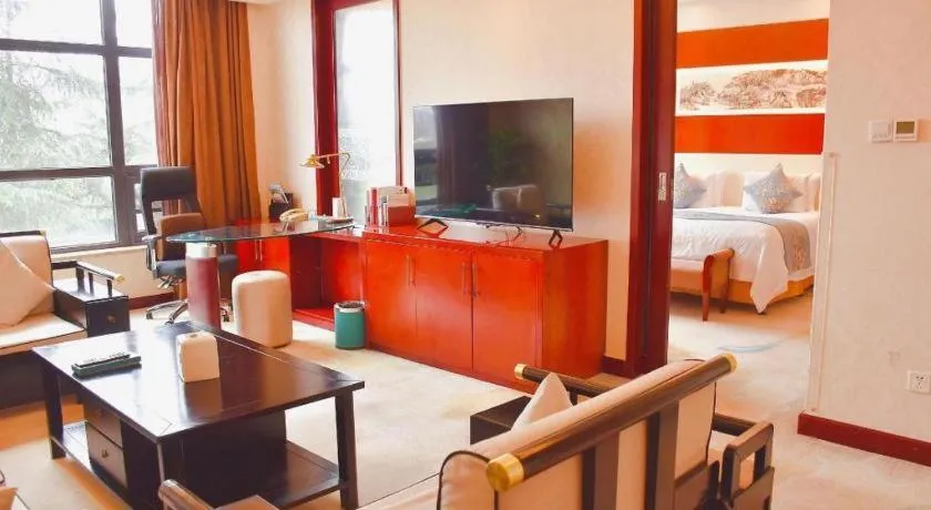 Bed in New Century Hotel Zaozhuang Fengming