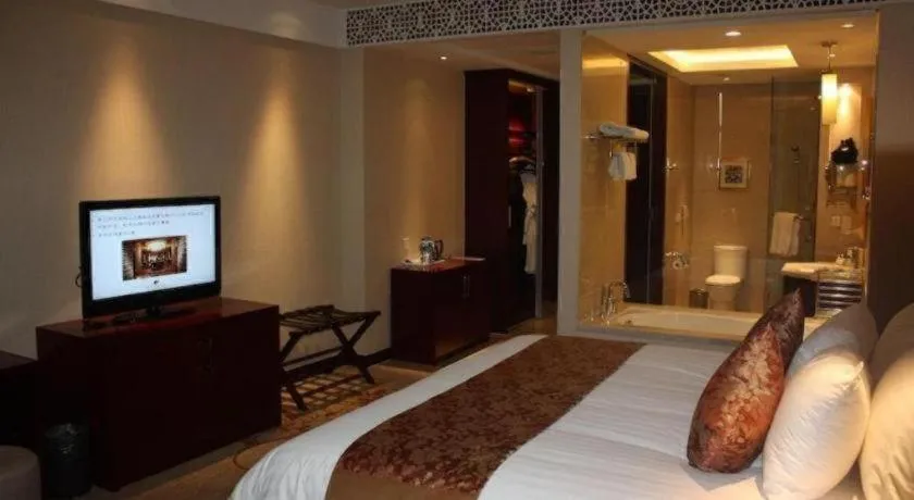 Bed in New Century Hotel Zaozhuang Fengming