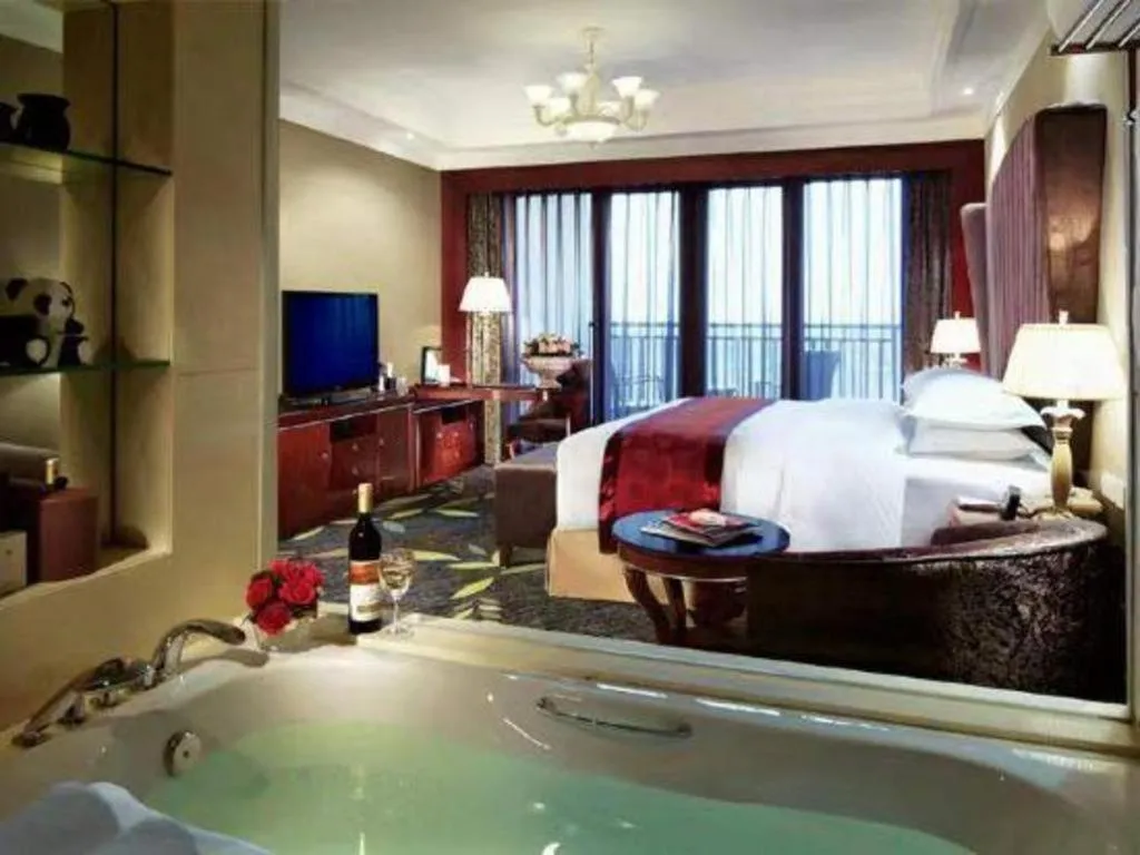 Bed in Xinjin Celebrity City Hotel