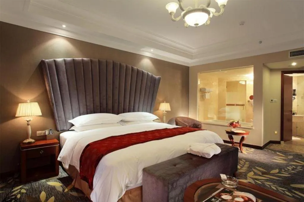 Bed in Xinjin Celebrity City Hotel