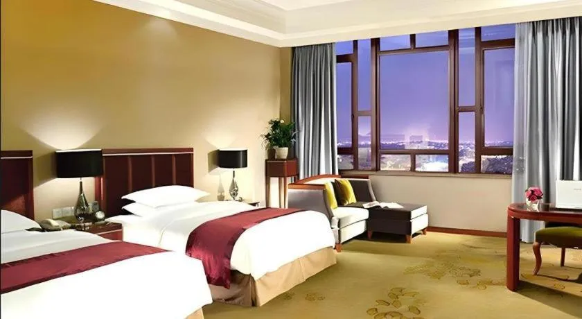 Bed in Xinjin Celebrity City Hotel