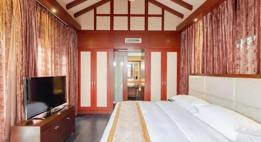 Bed in Xinjin Celebrity City Hotel