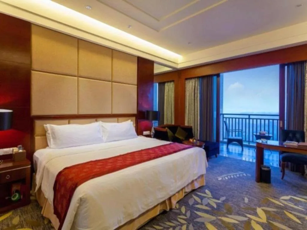 Bed in Xinjin Celebrity City Hotel