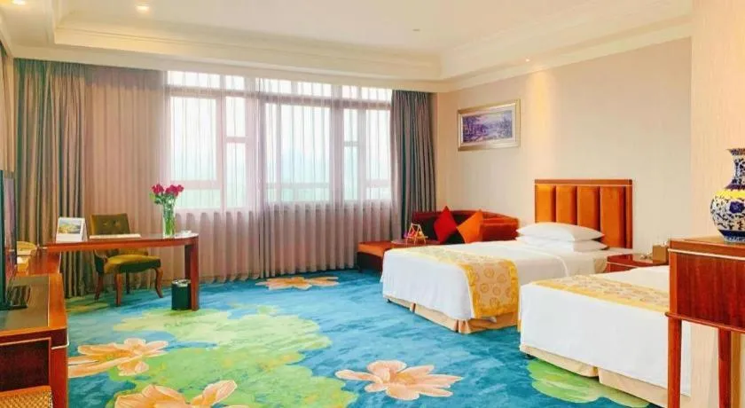 Bed in Xinjin Celebrity City Hotel