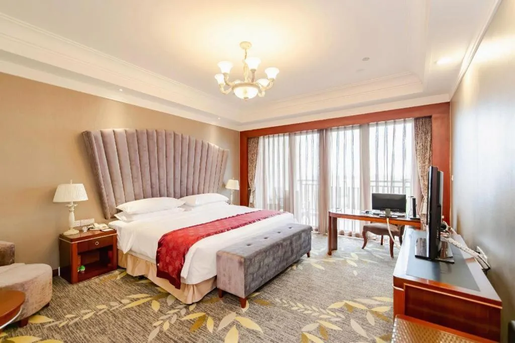 Bed in Xinjin Celebrity City Hotel