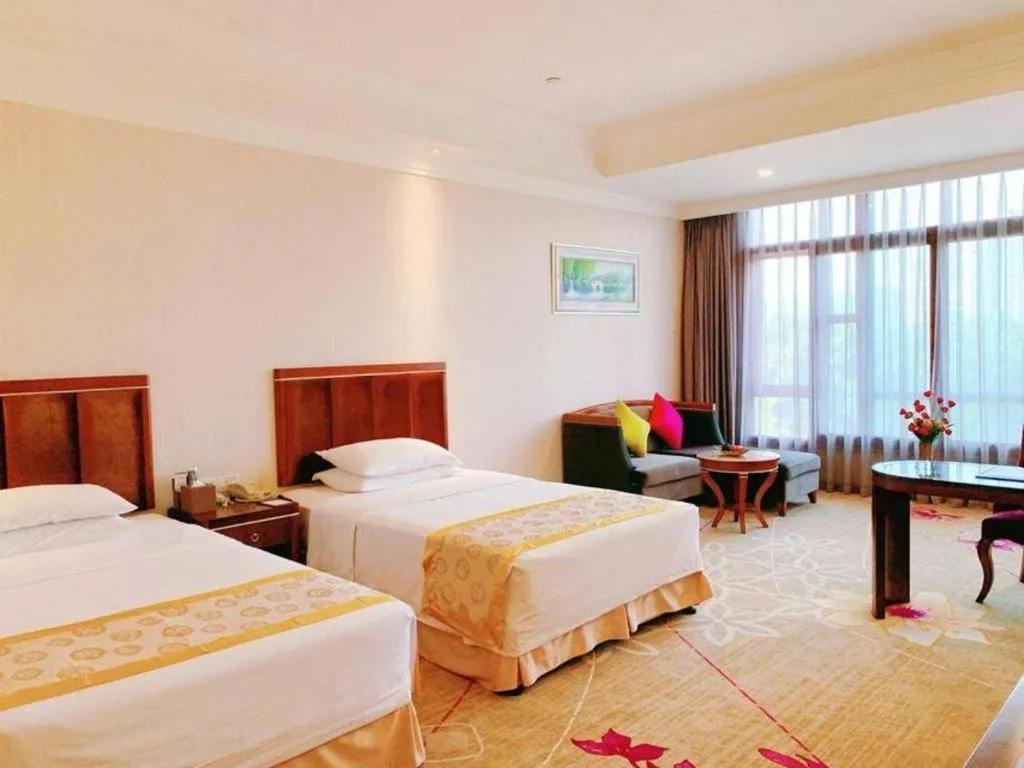 Bed in Xinjin Celebrity City Hotel