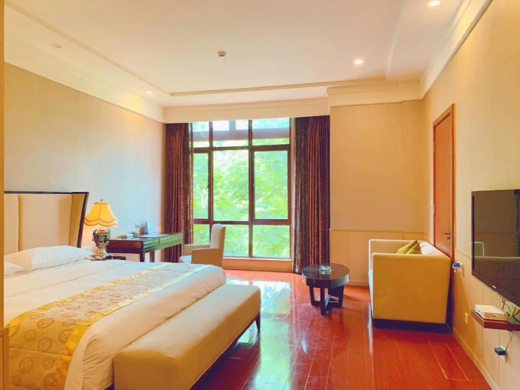 Bed in Xinjin Celebrity City Hotel