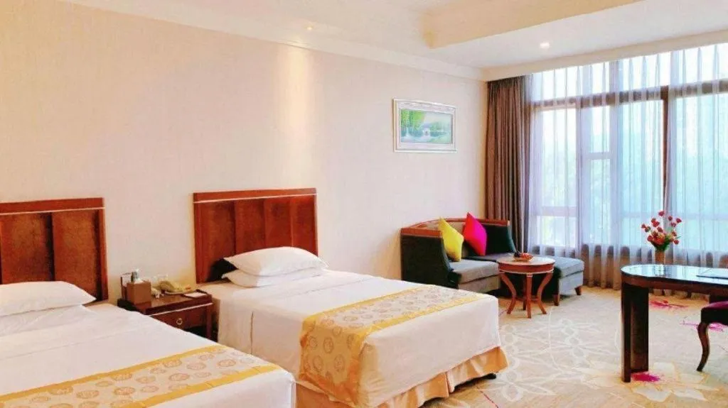 Bed in Xinjin Celebrity City Hotel