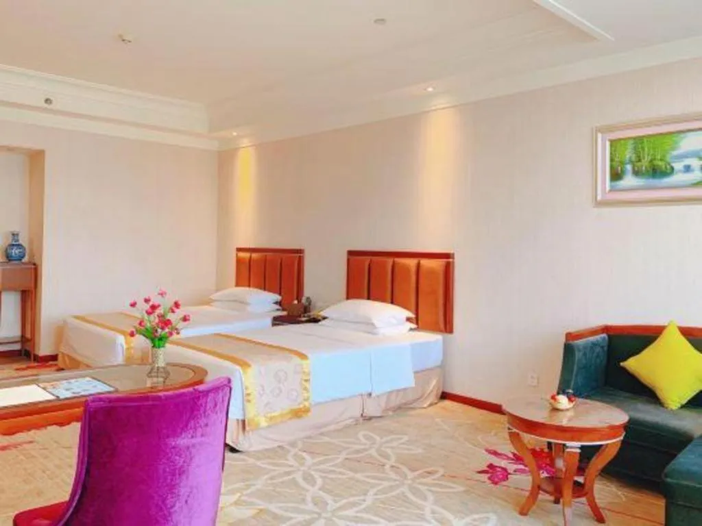 Bed in Xinjin Celebrity City Hotel